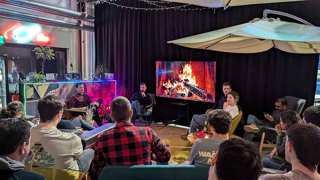 group of people at event in front of a fire place