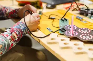 Artist Robin Baumgarten soldering pieces of the Quantum Jungle