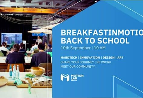 Group of people having breakfast and talk about tech at MotionLab.Berlin